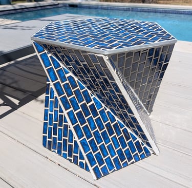 blue poolside tile table in sunlight