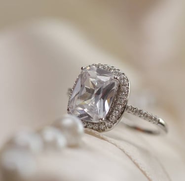 a ring with a CVD Lab-Grown Diamonds ring and a pearl ring