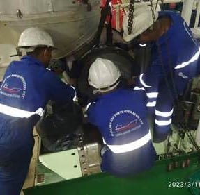 our service team on board the ship engine fixing turbocharger