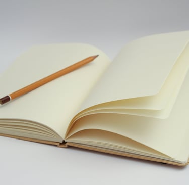 a pencil and pencil on a notebook with a pencil and pencil