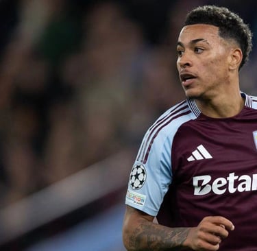 a soccer player in a maroon jersey and a white shirt