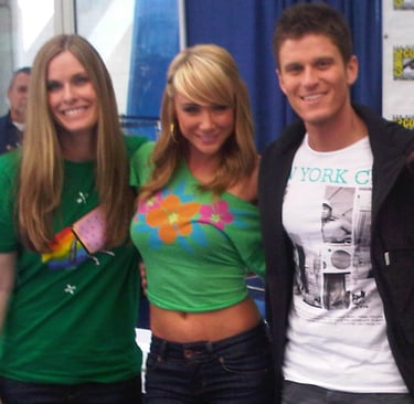 a group of people standing around a table