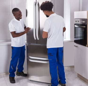 two men standing in front of a refrigerator
