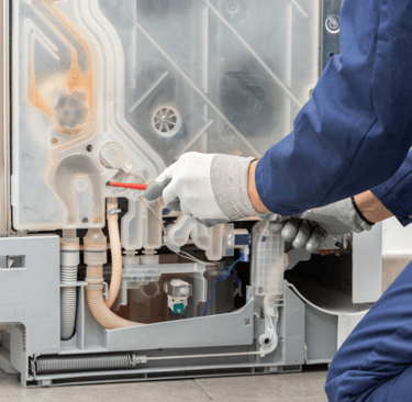 a person in a blue uniform is holding a wrench