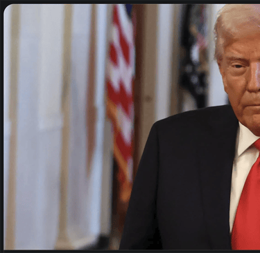 a man in a suit and tie with a red tie