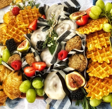 a brunch platter of waffles, fruit & patries