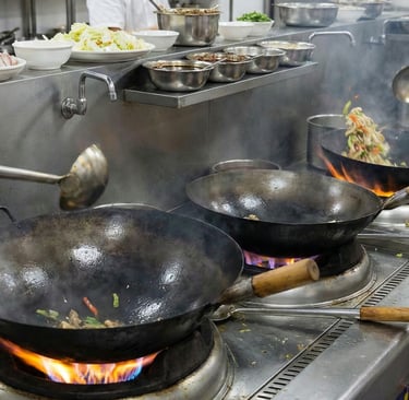 a person cooking in a kitchen with a lot of food,chinese cooking