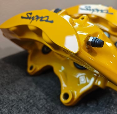Modified CTSV calipers prepared in Signal Yellow for a MKIV Supra