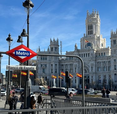 A Metro sign in front of Madrid City Hall