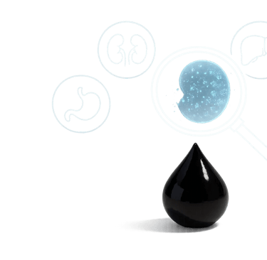 A clean clinical background with a large white surface. A single black Shilajit resin drop.