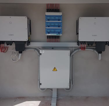 a small electrical device with a box of electrical equipment