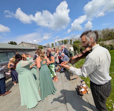 A professional fiddler performing high-energy folk music with Rowans ceilidh band.