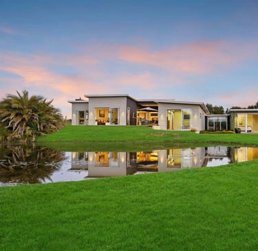 new addition countryside mono pitched weatherboard home, existing garage
