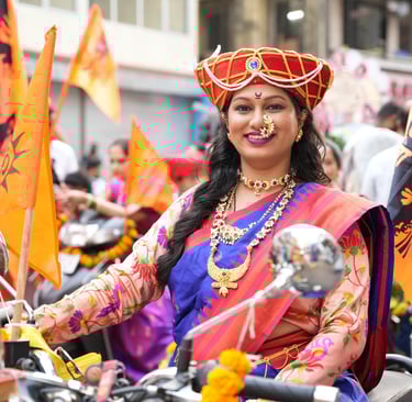 woman in maharastrian traditional outfit riding a motorbike in girgaon gudipadwa shobhayatra 2025