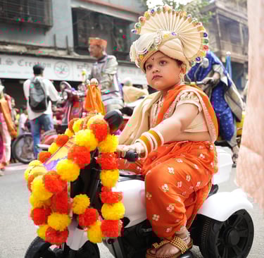 girl kid in maharastrian traditional outfit riding a motorbike in girgaon gudipadwa shobhayatra 2025
