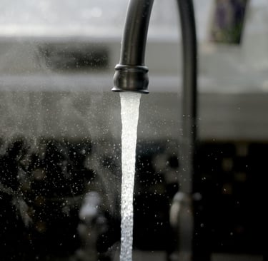 Black kitchen tap running water