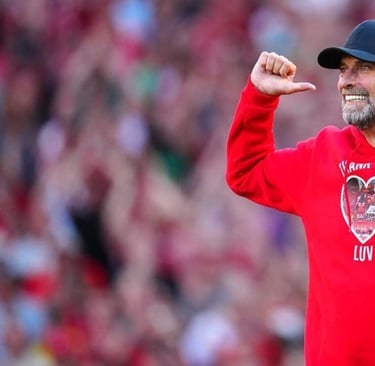 a man in a red hoodie and a baseball cap