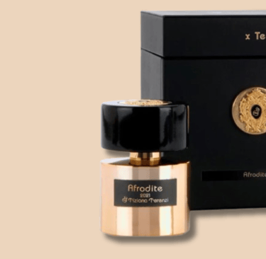 a bottle of perfume with a black box and a gold medal - afrodite da tiziana terenzi