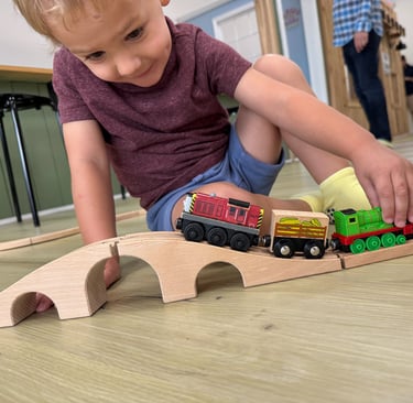 kid playing with trains