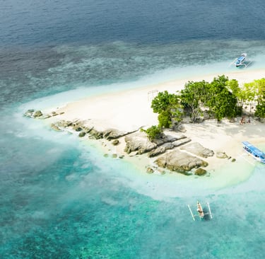 a small island with boats and trees in the water, Snorkeling & Keliling Pulau Gili Barat Daya
