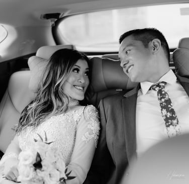 a bride and groom in a car