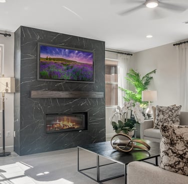 a living room with a fireplace and a television