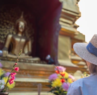 Solo female traveler meditating in Chiang Mai temple