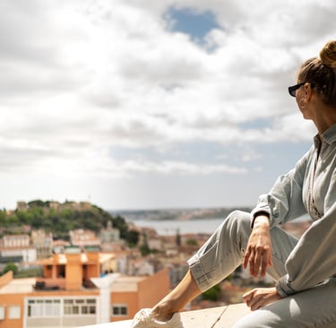 Female traveler enjoying sea view in Lisbon