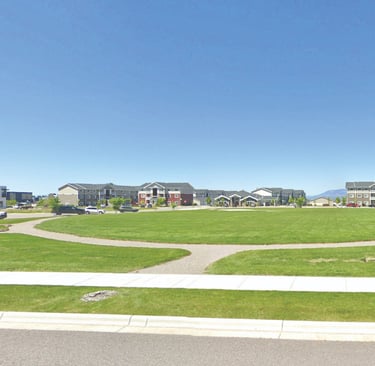 a park with a circular shaped lawn and a circular shaped lawn