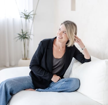 Psychotherapist in Singapore Yvonne smiling, soft lighting, laughing.