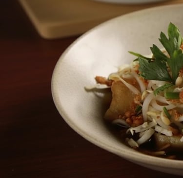 a bowl of food with a fork and a fork