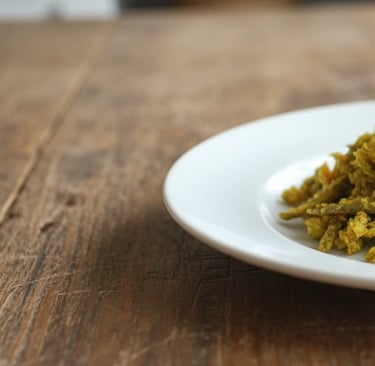 a plate of food with a pile of food on a table