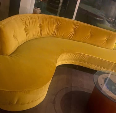  side view reupholstered boomerang sofa in gold velvet