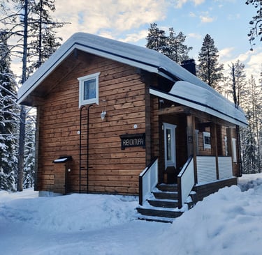 Rustic finnish log cabin in a snowy winter landscape, riekontupa cabin located in Kittilä lapland