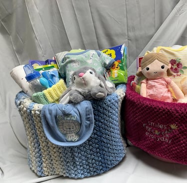 A pair of New Baby Welcome Baskets. Welcome Baskets contain everything baby needs for the first week