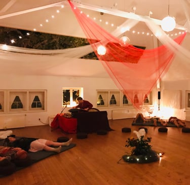 a room with a lot of people sitting on the floor