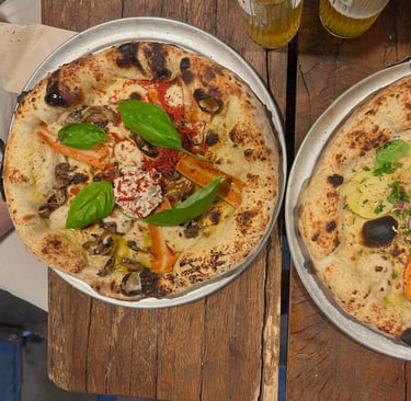 Two vegan pizzas with vegetables
