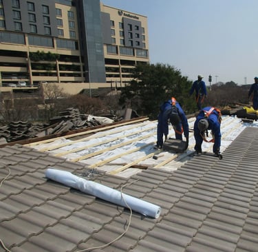 Laying roof tiles for roof installation Project, Environmental Pro Construction