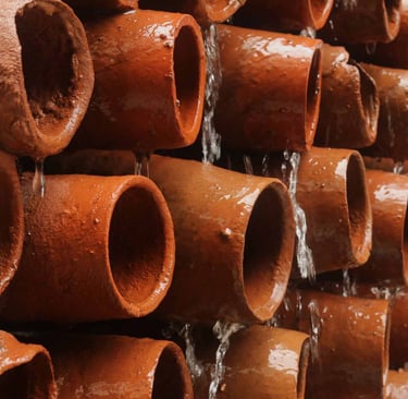 water dripping on earthern pots