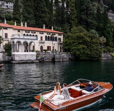 a boat on the water with a bride and groom