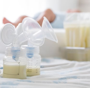 a baby bottle with a bottle of milk and a bottle of milk