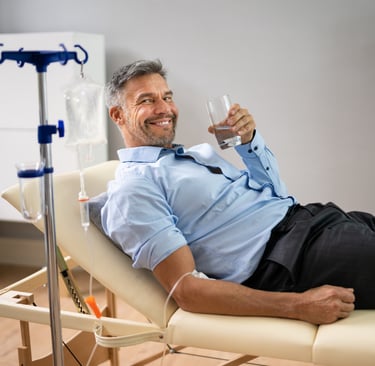 a man in receiving an IV drip to help restore his health
