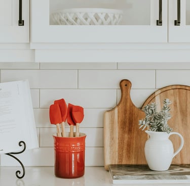 a kitchen counter top with a cutting board and a cutting board
