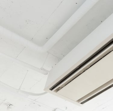 a ceiling mounted air conditioner with a white ceiling fan