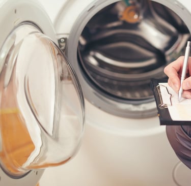 a man in overalls and overalls is writing on a clipboard