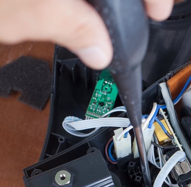 a man is cleaning a carpet with a vacuum