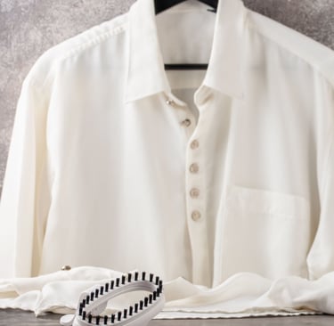 a white shirt and a white shirt with a blue and white shirt