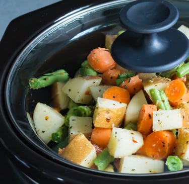 a potted potted with vegetables in a slow cooker