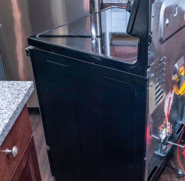 a man in a kitchen with a refrigerator and a refrigerator