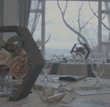 Ungraded picture of a table with a vase of flowers and wine glasses